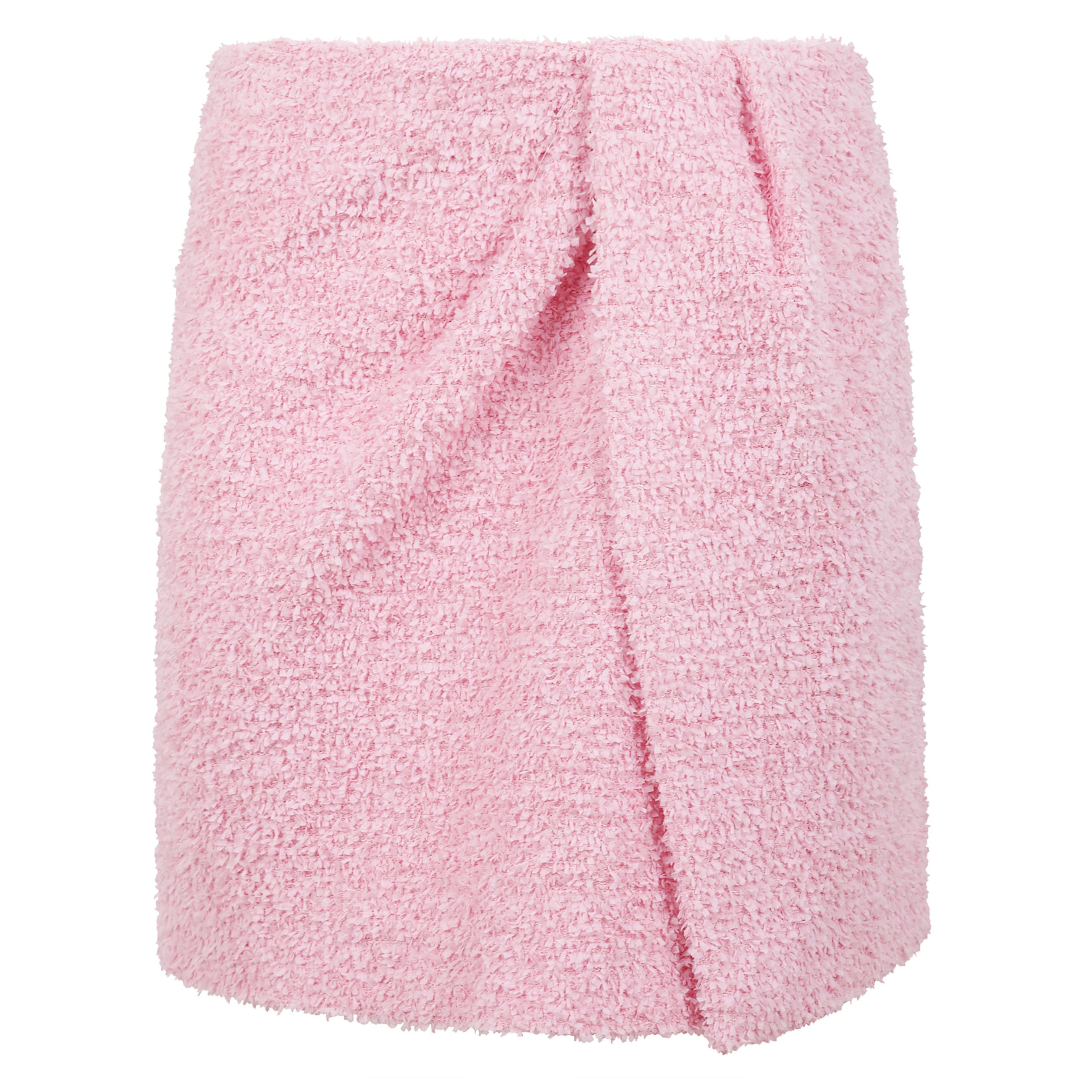 Gonna corta in tweed effetto spugna tinta unita caratterizzata da una costruzione a finto portafoglio con incrocio sul davanti. chiusura con zip sul fianco. label msgm cucita sul retro.