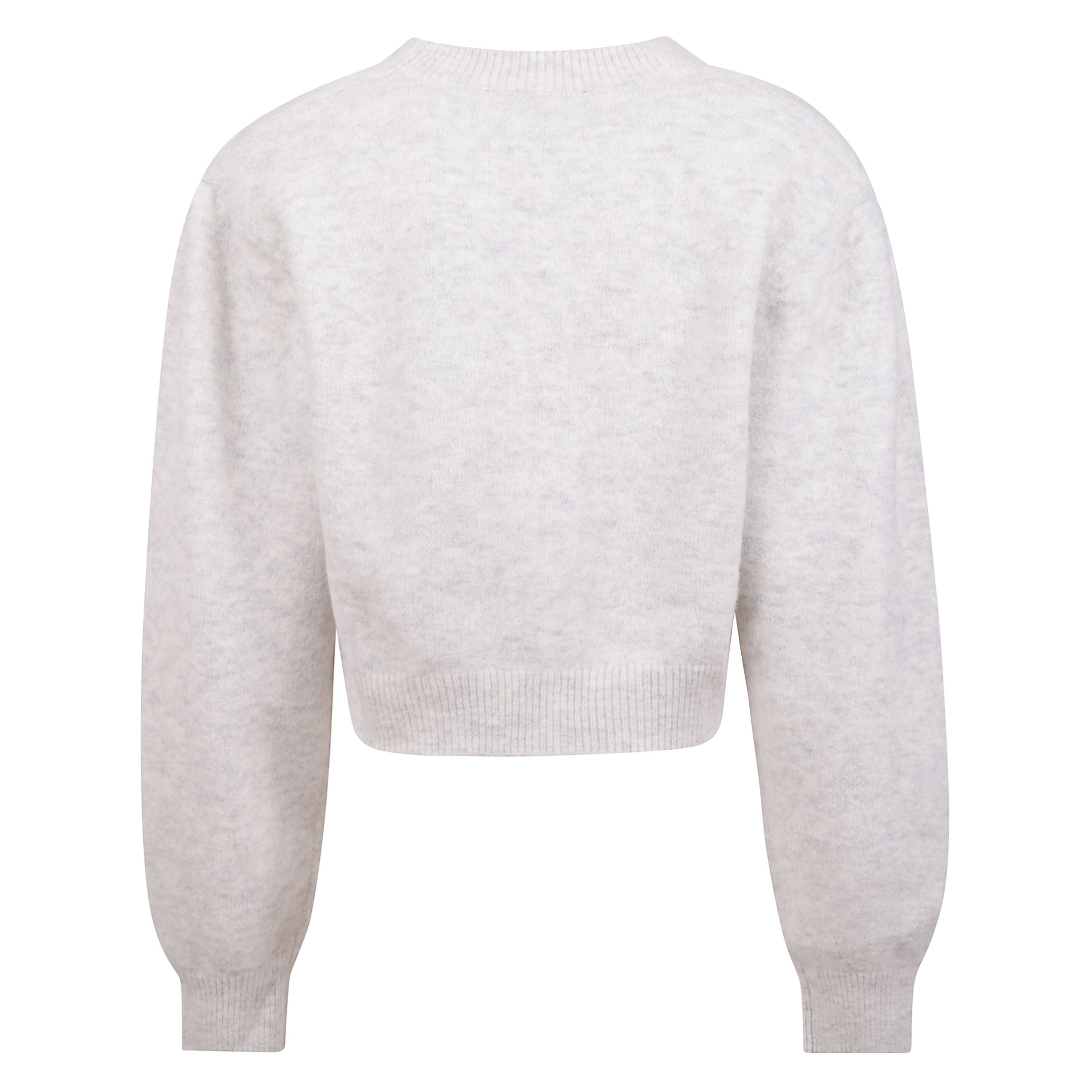 Cardigan in maglia con maniche a sbuffo e scollatura a v. silhouette corta con polsini aderenti e orlo a coste. spalle arricciate e spalline removibili. decorazione in maglia rosa rimovibile al centro davanti.