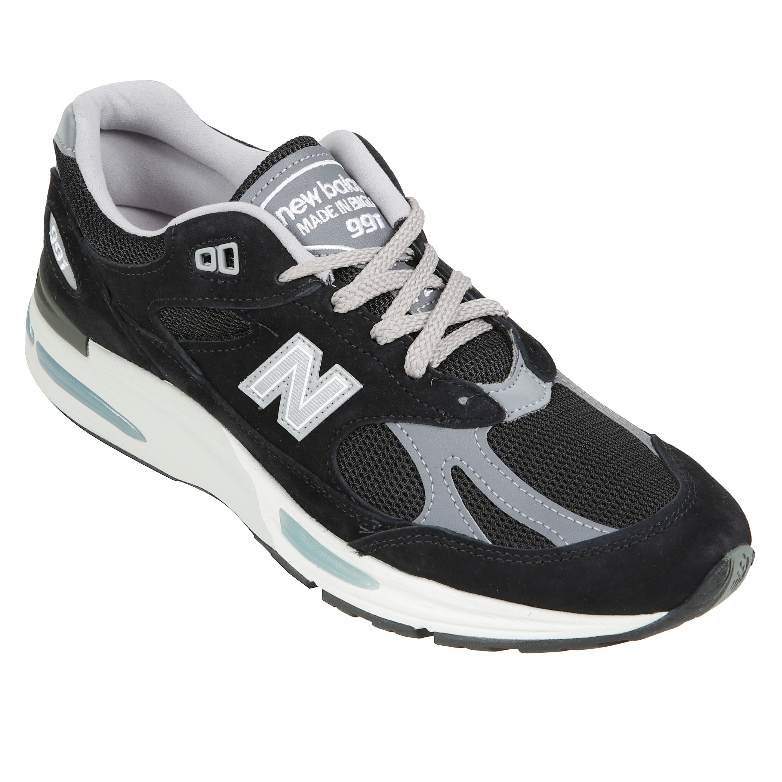 Sneakers con tomaia in pelle e materiale sintetica, allacciatura frontale, dettagli logo e suola in gomma