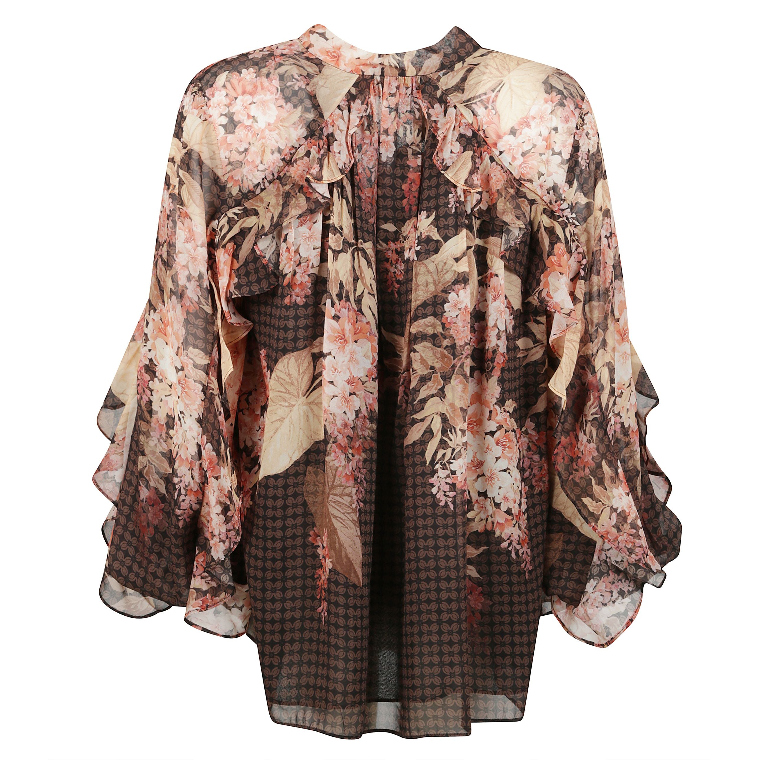 Blusa con volant illuminate in nero floreale della nostra collezione primavera prÃªt-Ã -porter 2025, illumination. blusa con stampa caratterizzata da scollo a v con laccetti al collo, maniche a sbuffo lunghe con polsini elasticizzati e ruches su spalle, s